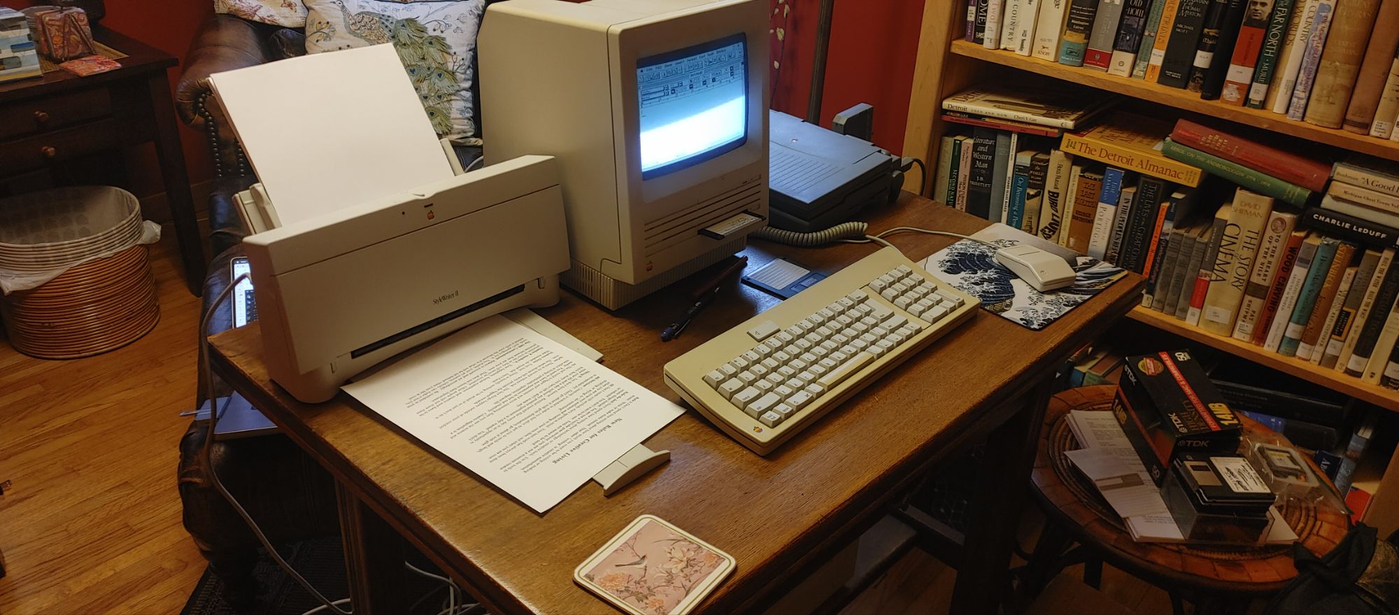 The 1987 Macintosh SE running Macintosh System Software 7 connected to a Stylewriter II inkjet printer. Bonus points if you noticed the Powerbook 180 (1992) sitting on the table next to it.